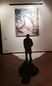 Man and shadow are part of the painting.
